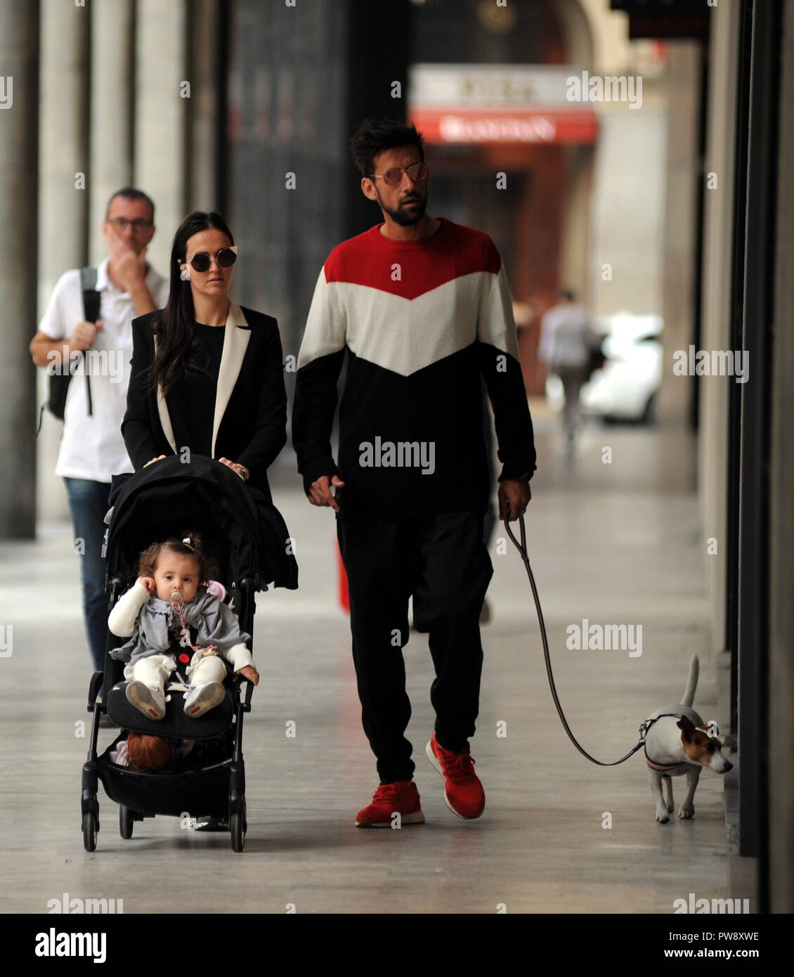 Milan, Nicolas Spolli and family shopping in the center Nicolas Spolli, the Argentine defender of GENOA, arrives in the center with his wife ANGELA and his daughter born a few months ago. After a long walk in Via Montenapoleone decide to enter from the 'IL GUFO' a shop specializing in the sale of clothes for children and babies and shopping. Stock Photo