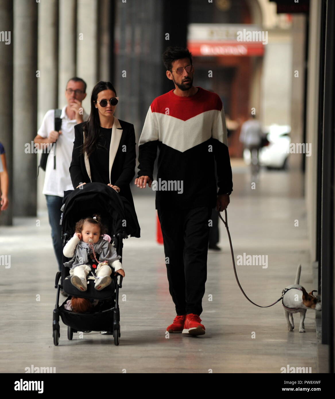 Milan, Nicolas Spolli and family shopping in the center Nicolas Spolli, the Argentine defender of GENOA, arrives in the center with his wife ANGELA and his daughter born a few months ago. After a long walk in Via Montenapoleone decide to enter from the 'IL GUFO' a shop specializing in the sale of clothes for children and babies and shopping. Stock Photo