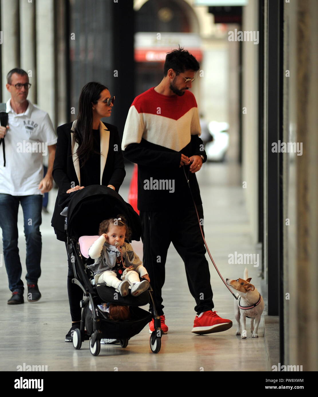 Milan, Nicolas Spolli and family shopping in the center Nicolas Spolli, the Argentine defender of GENOA, arrives in the center with his wife ANGELA and his daughter born a few months ago. After a long walk in Via Montenapoleone decide to enter from the 'IL GUFO' a shop specializing in the sale of clothes for children and babies and shopping. Stock Photo