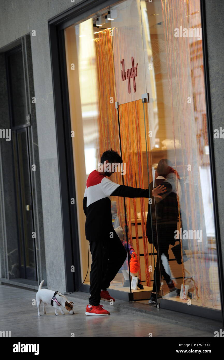 Milan, Nicolas Spolli and family shopping in the center Nicolas Spolli, the Argentine defender of GENOA, arrives in the center with his wife ANGELA and his daughter born a few months ago. After a long walk in Via Montenapoleone decide to enter from the 'IL GUFO' a shop specializing in the sale of clothes for children and babies and shopping. Stock Photo