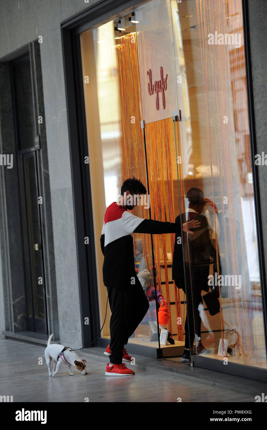 Milan, Nicolas Spolli and family shopping in the center Nicolas Spolli, the Argentine defender of GENOA, arrives in the center with his wife ANGELA and his daughter born a few months ago. After a long walk in Via Montenapoleone decide to enter from the 'IL GUFO' a shop specializing in the sale of clothes for children and babies and shopping. Stock Photo