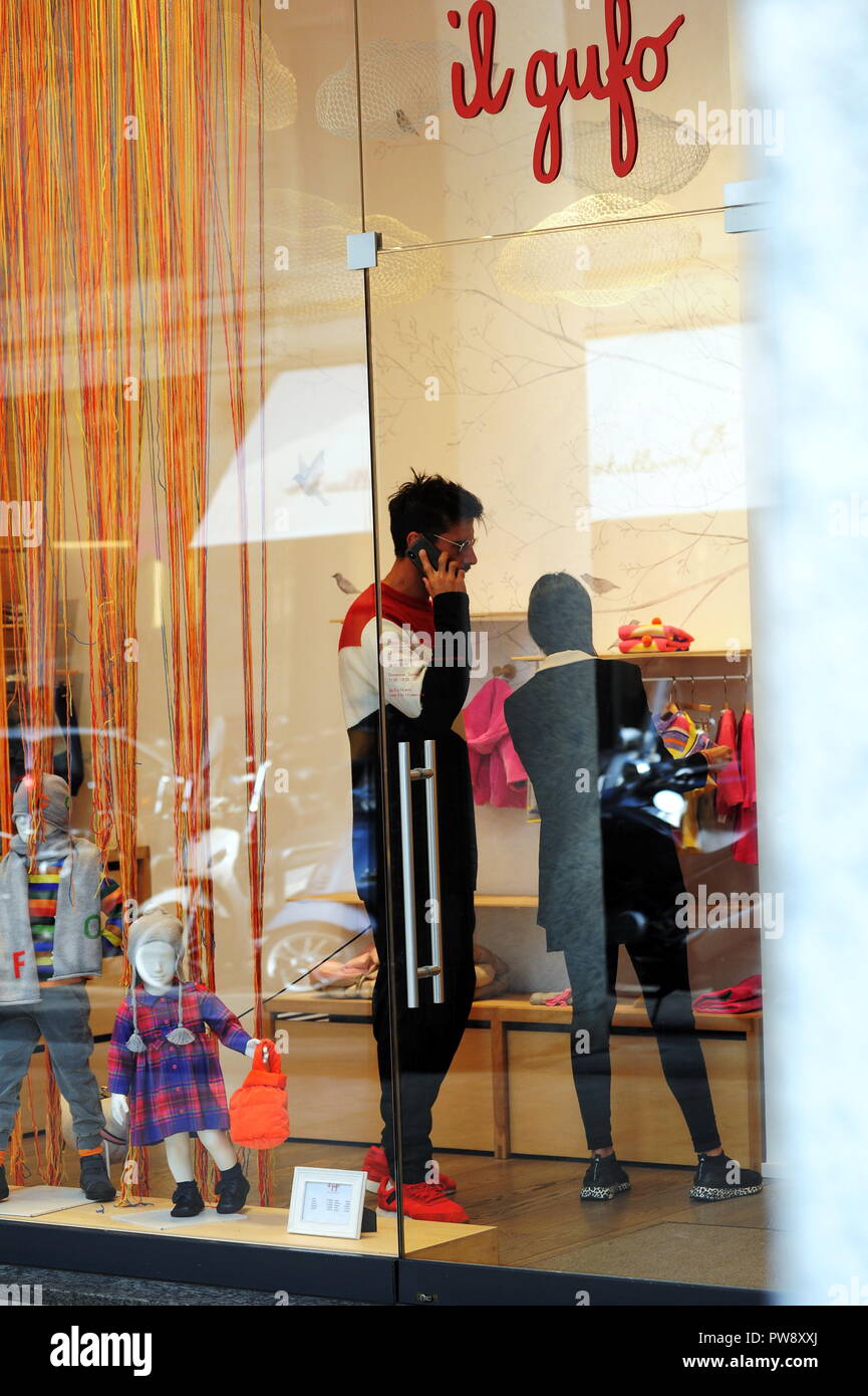 Milan, Nicolas Spolli and family shopping in the center Nicolas Spolli, the Argentine defender of GENOA, arrives in the center with his wife ANGELA and his daughter born a few months ago. After a long walk in Via Montenapoleone decide to enter from the 'IL GUFO' a shop specializing in the sale of clothes for children and babies and shopping. Stock Photo