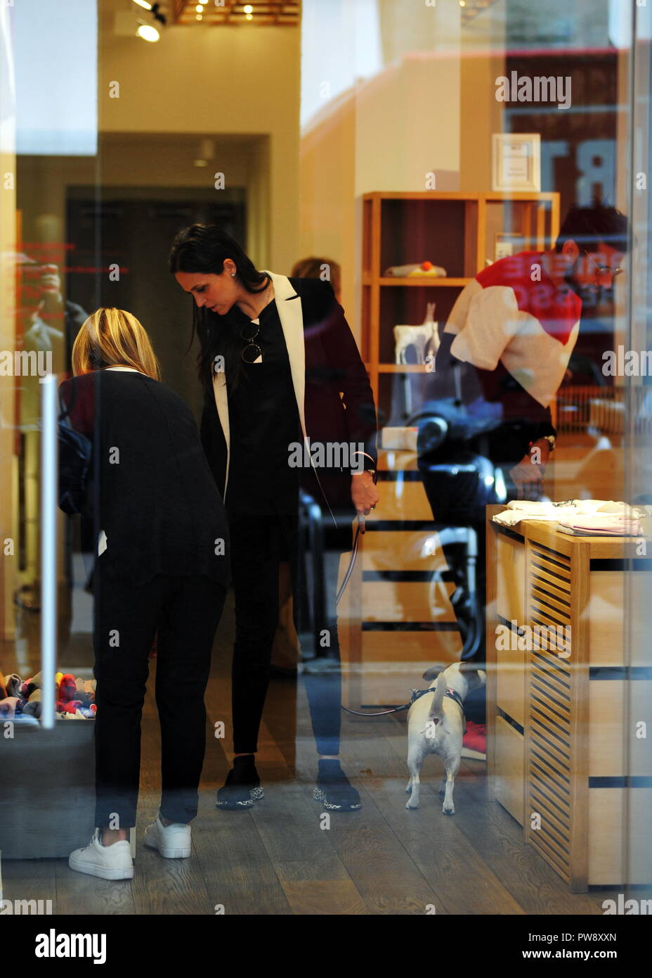Milan, Nicolas Spolli and family shopping in the center Nicolas Spolli, the Argentine defender of GENOA, arrives in the center with his wife ANGELA and his daughter born a few months ago. After a long walk in Via Montenapoleone decide to enter from the 'IL GUFO' a shop specializing in the sale of clothes for children and babies and shopping. Stock Photo