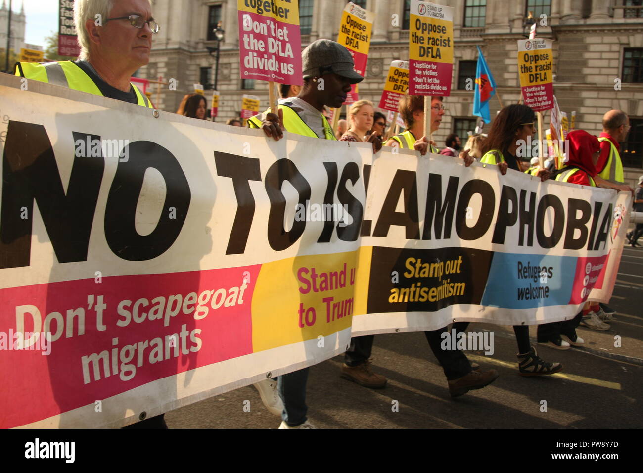 London, UK. 13th October, 2018. Campaign group Stand Up To Racism held a march and rally in Whitehall. The purpose of the protest was to prevent the far right group DFLA (Democratic Football Lads Alliance) from marching through Whitehall and past Parliament. Roland Ravenhill/Alamy Live News Stock Photo