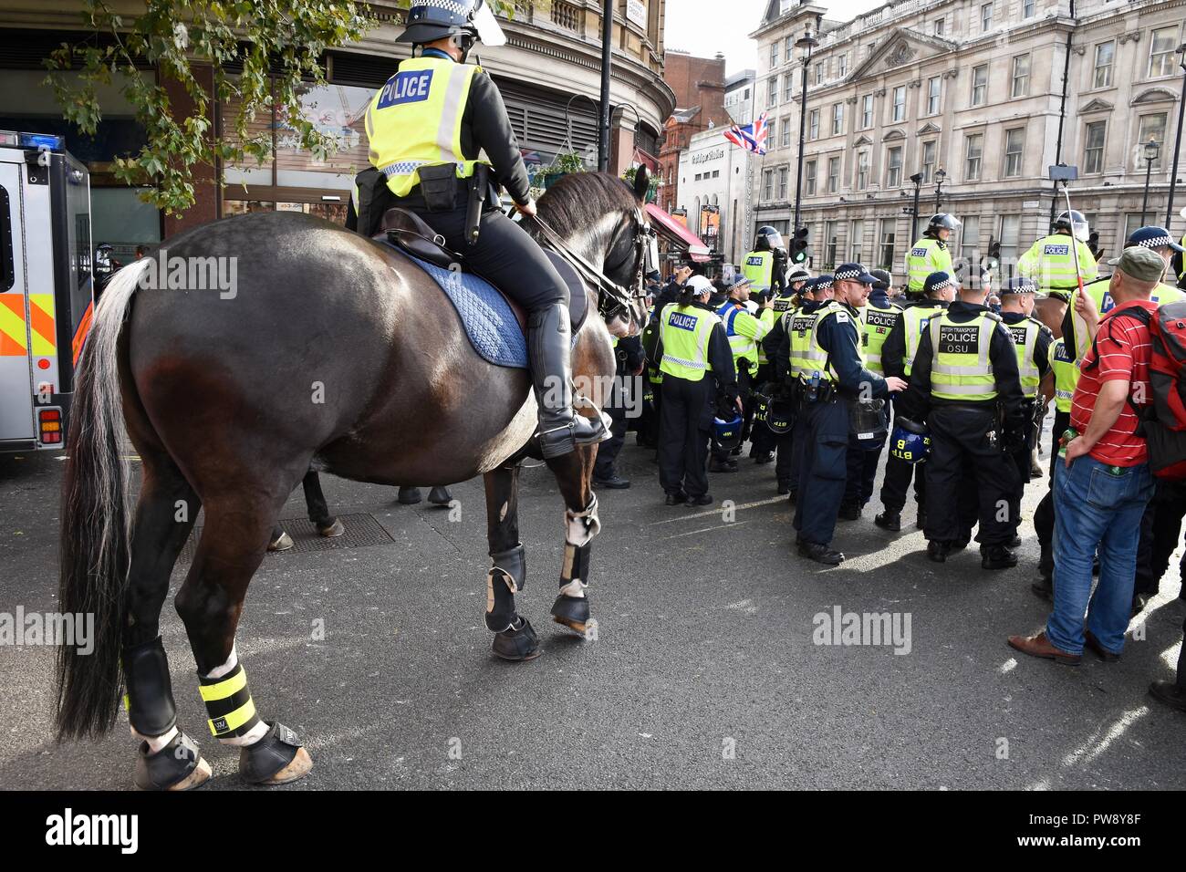 13th October 2018. Democratic Football Lads Alliance March, The Police formed a barrier between rival groups the DFLA and anti fascists, Trafalgar Square, London.UK  Credit: michael melia/Alamy Live News Stock Photo