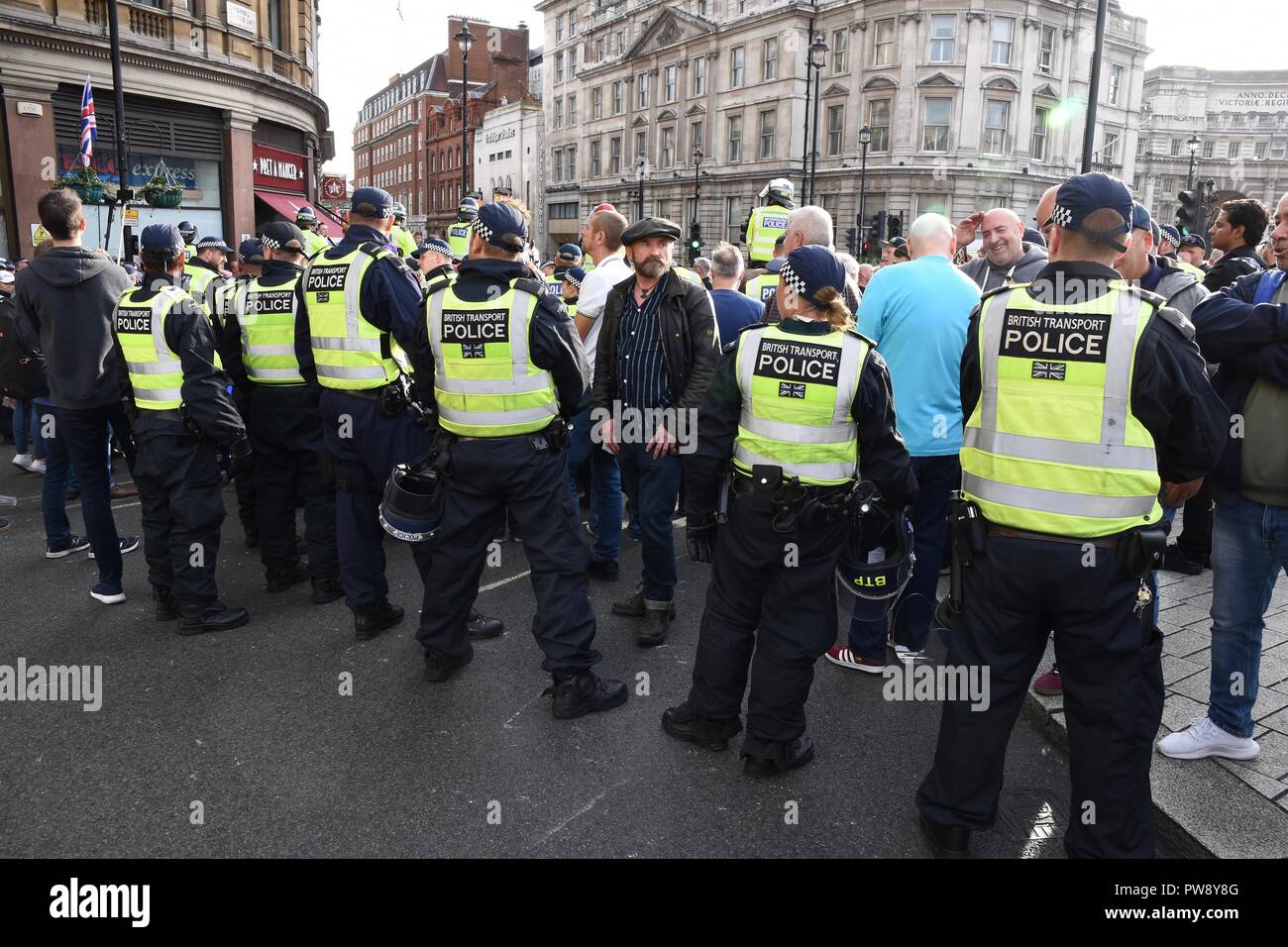 13th October 2018. Democratic Football Lads Alliance March,The Police formed a barrier between rival groups the DFLA and anti fascists,Trafalgar Square,London.UK Credit: michael melia/Alamy Live News Stock Photo