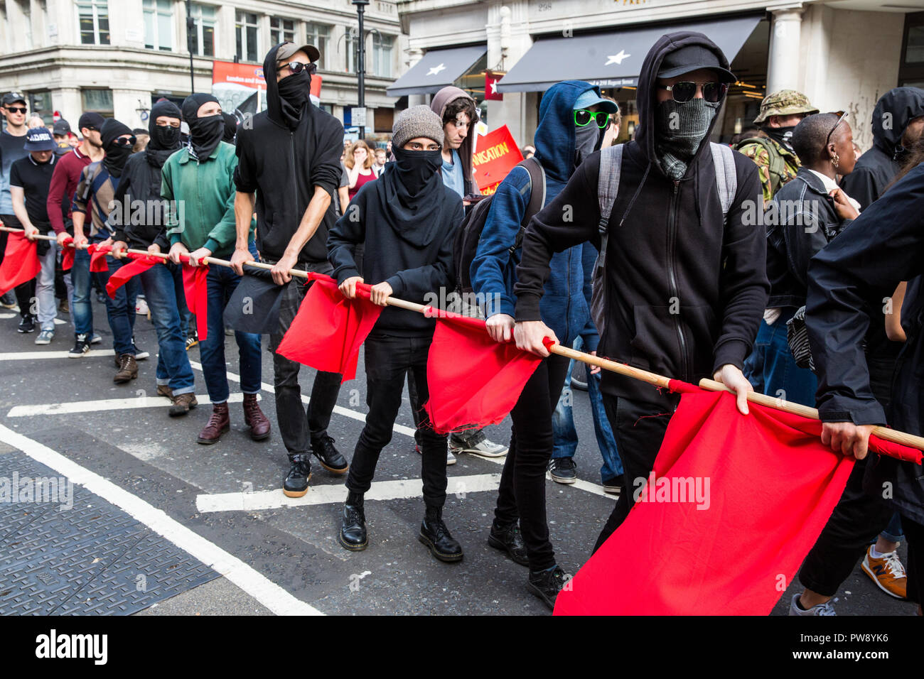 London, UK. 13th October, 2018. Anti-fascist groups including many women from the Feminist Anti-Fascist Assembly march through London in protest against a demonstration by the far-right Democratic Football Lads Alliance (DFLA). Anti-racist groups also held a Unity demonstration to coincide with the DFLA demonstration. Credit: Mark Kerrison/Alamy Live News Stock Photo