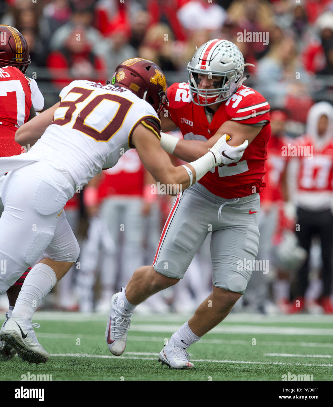 Columbus, Ohio, USA. 13th Oct, 2018. linebacker Tuf Borland (32) of the Ohio State Buckeyes and tight end Jake Paulson (80) of the Minnesota Golden Gophers at the NCAA football game between the Minnesota Golden Gophers & Ohio State Buckeyes at Ohio Stadium in Columbus, Ohio. JP Waldron/Cal Sport Media/Alamy Live News Stock Photo