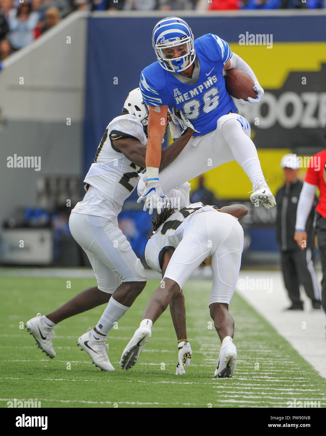 October 13, 2018: Memphis Tigers tight end, JOEY MAGNIFICO (86), jumps over UCF defenders during the NCAA football game between the Memphis Tigers and the Central Florida Knights at Liberty Bowl Stadium in Memphis, TN. Memphis leads UCF at the half, 59-22. Kevin Langley/CSM Stock Photo