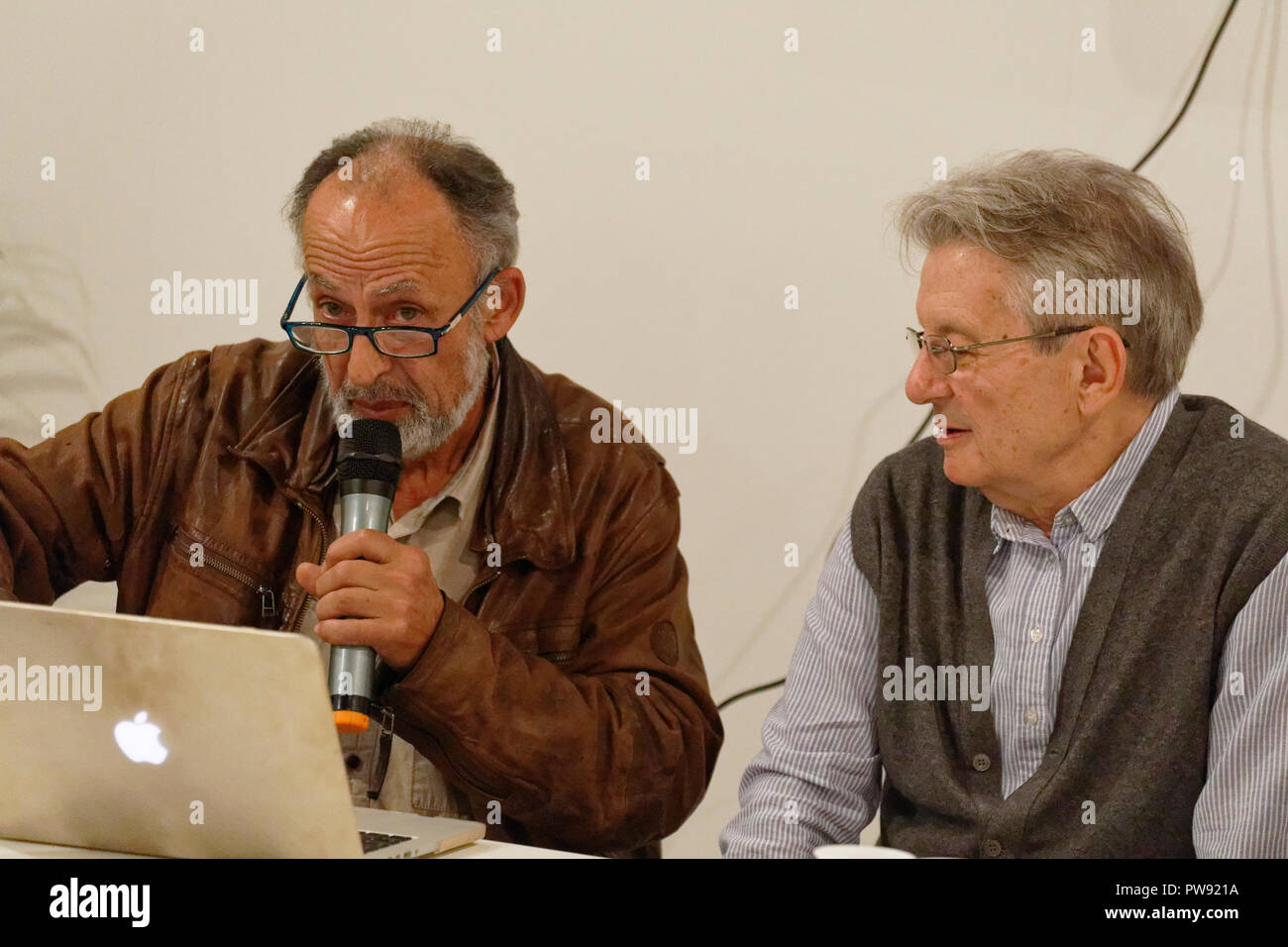 Turin, Italy. 13th October, 2018. Manoocher Deghati and Adriano Sofri give a public lecture at the World Press Photo 2018 exhibition. MLBARIONA/Alamy Live News Stock Photo