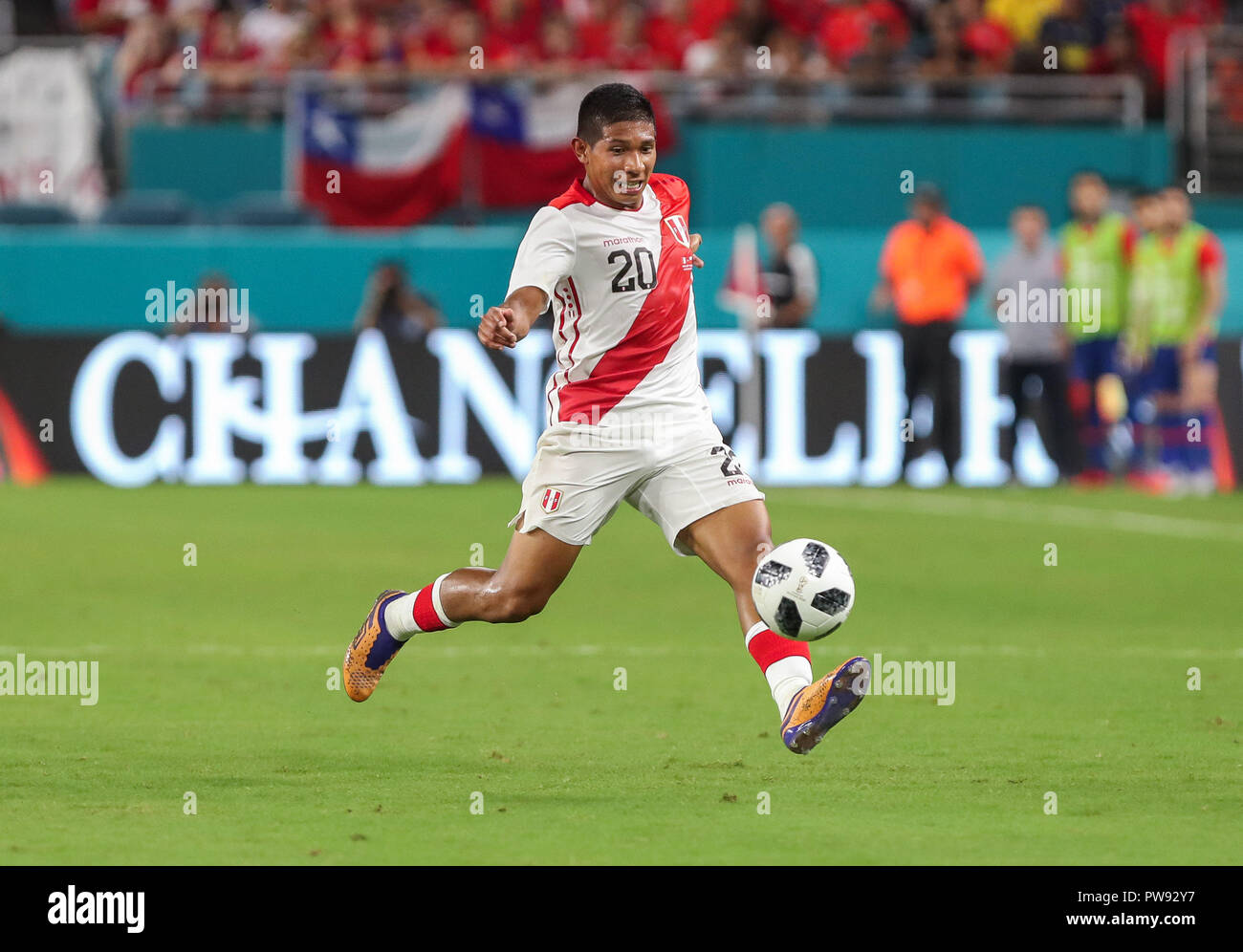 Miami Gardens, Florida, USA. 12th Oct, 2018. Peru midfielder EDISON FLORES (20) drives the ball during an international friendly match between the Peru and Chile national soccer teams, at the Hard Rock Stadium in Miami Gardens, Florida. Credit: Mario Houben/ZUMA Wire/Alamy Live News Stock Photo
