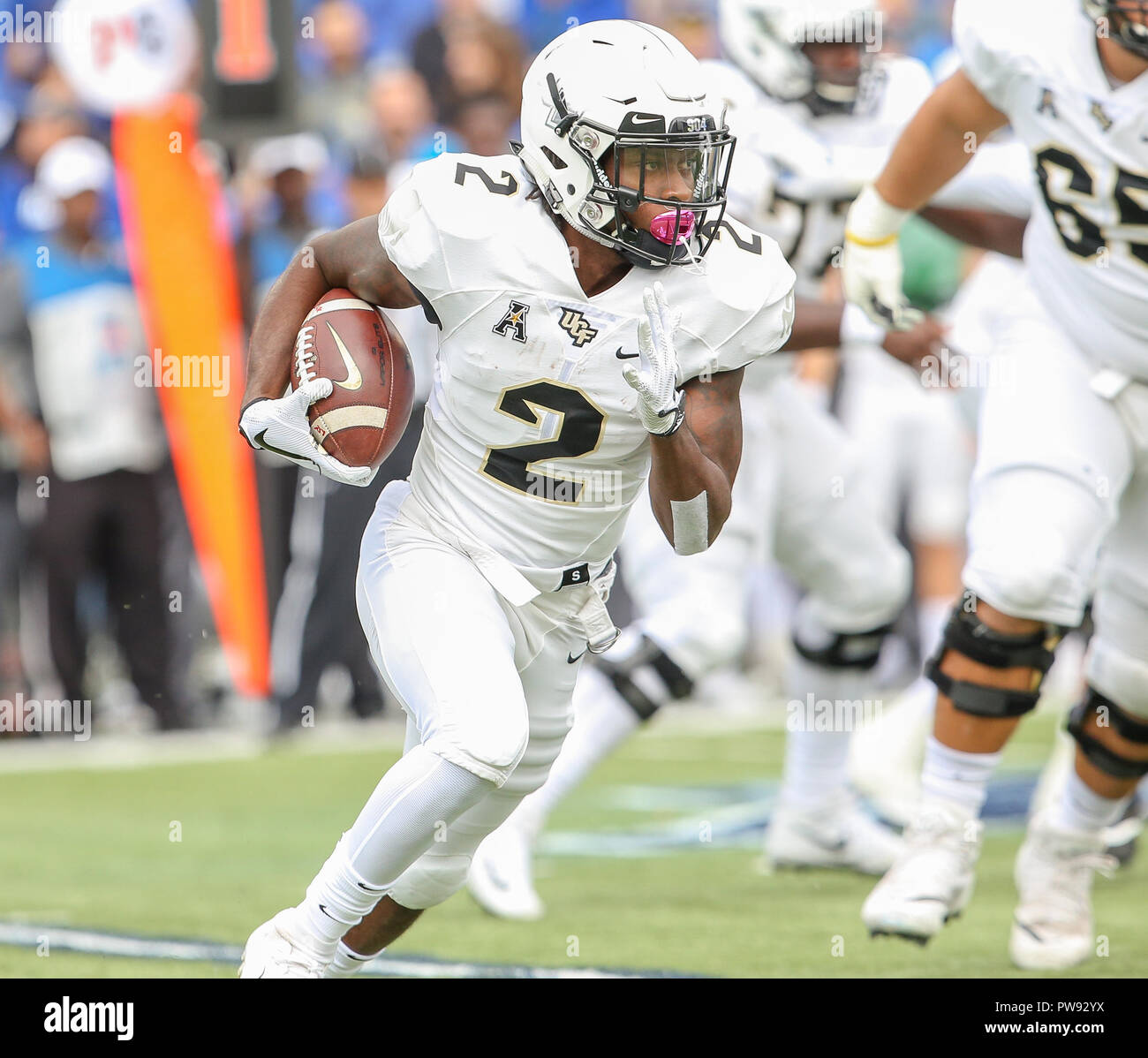 memphis tennessee usa 13th oct 2018 ucf s otis anderson 2 carries the ball towards the sidelines during the ncaa football game between the memphis tigers and the ucf knights at liberty bowl
