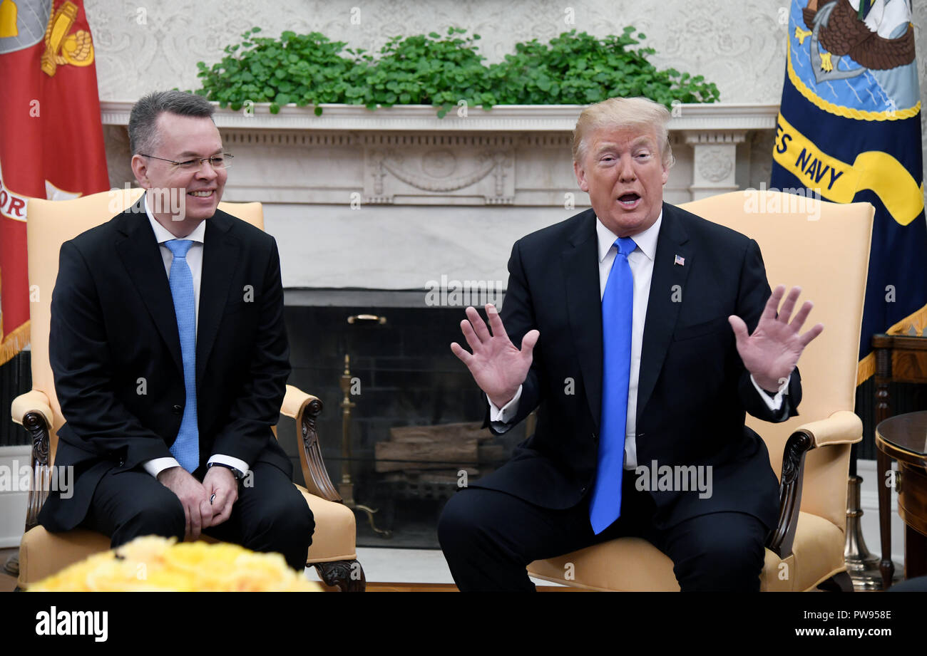 Washington, District of Columbia, USA. 13th Oct, 2018. U.S. President DONALD TRUMP meets with Pastor ANDREW BRUNSON in the Oval Office of the White House. Pastor Andrew Brunson arrived back in the U.S. on Saturday after being held in Turkey for two years on terrorism charges. Credit: Olivier Douliery/CNP/ZUMA Wire/Alamy Live News Stock Photo
