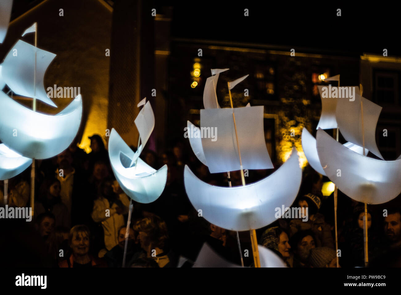 Paper boat lanterns carried by children in the Clifden festival procession, County Galway