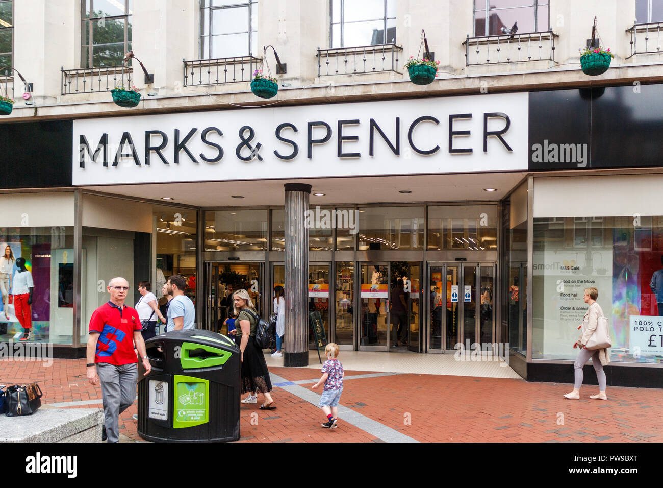 Reading, England - 1st June 2018: People walking past the entrance to Marks and Spencer. The chain has recently announced store closures. Stock Photo