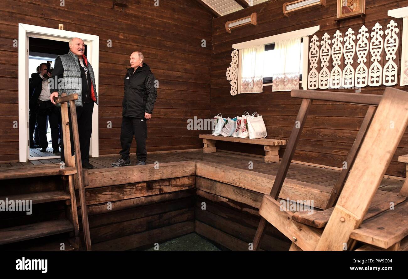 Russian President Vladimir Putin, right, is given a tour of the Trofimov Springs in the Alexandria agricultural community by Belarus President Alexander Lukashenko October 12, 2018 n Sokolowski District, Belarus. Lukashenko was born and raised in the community. Stock Photo