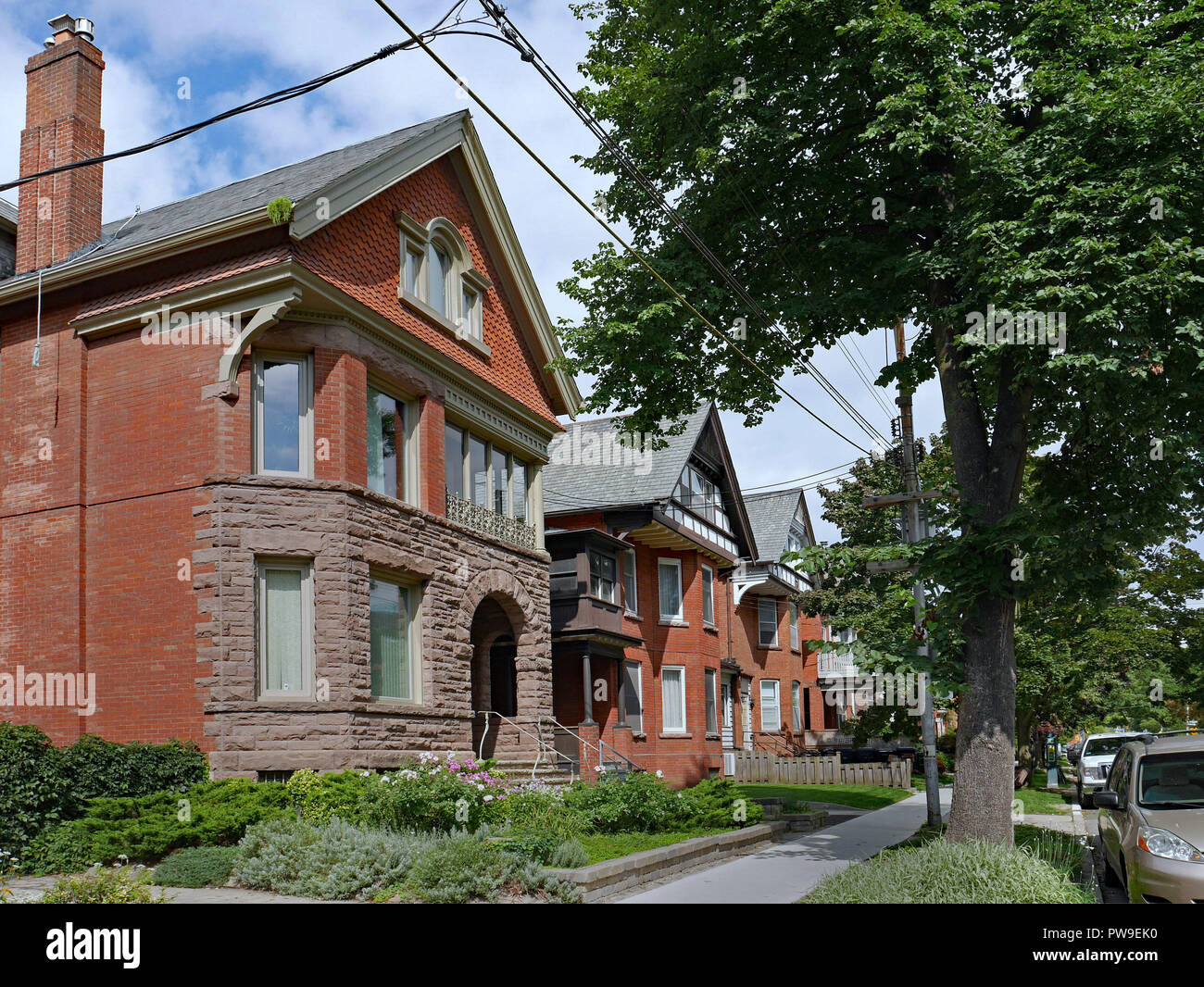 row of large old brick houses with gables Stock Photo - Alamy