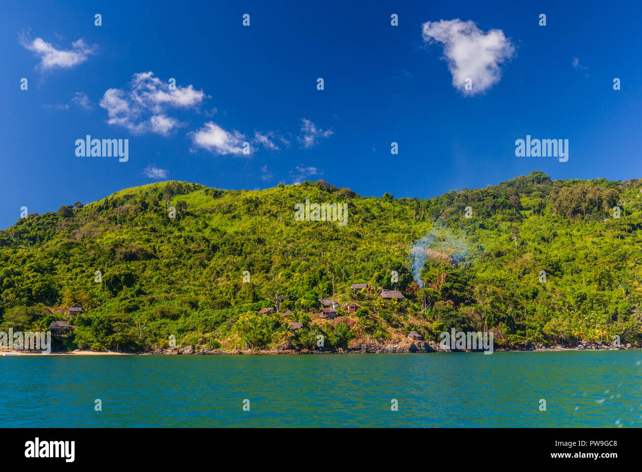 Green island on the blue ocean Stock Photo - Alamy