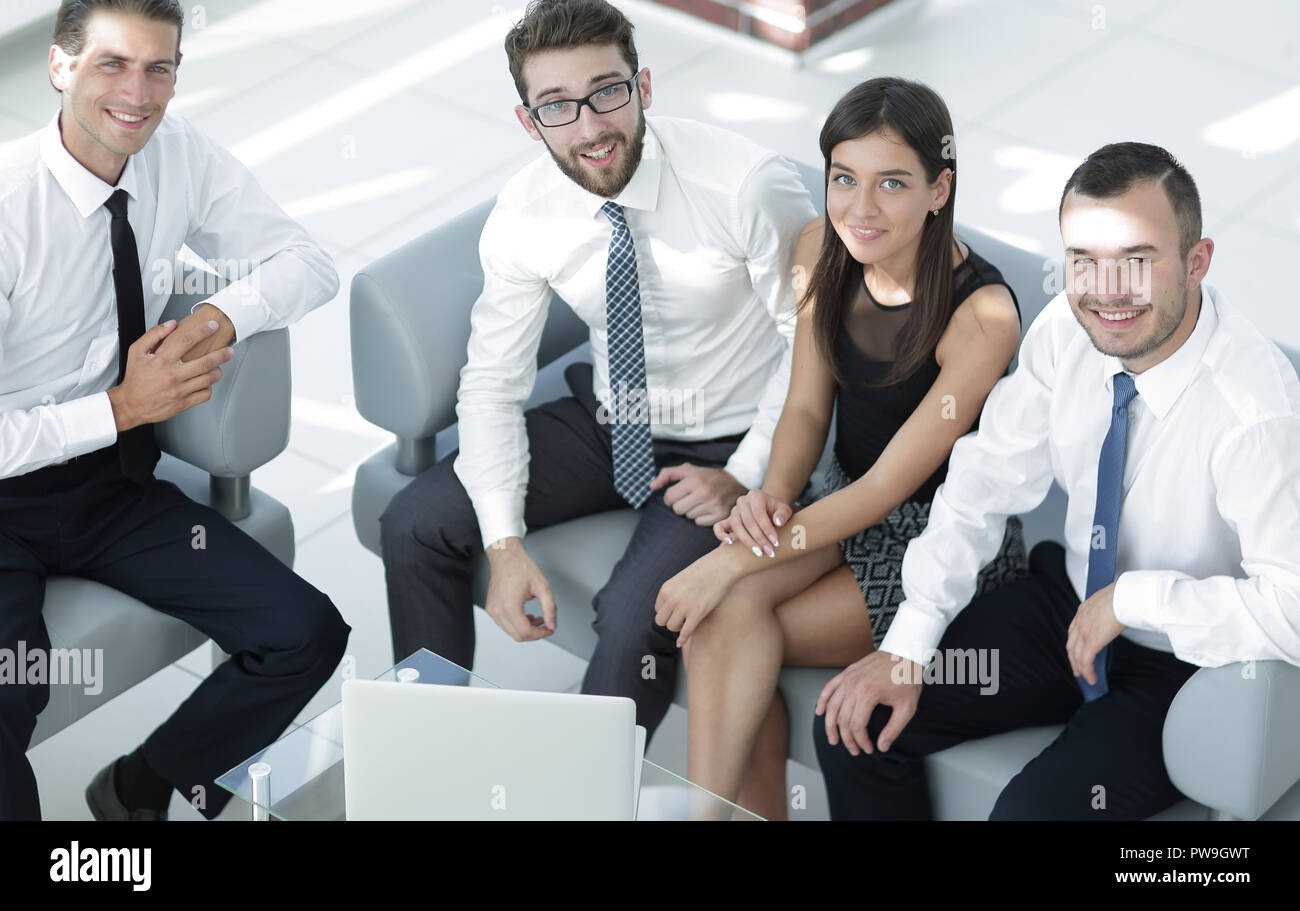 successful business team sitting in office lobby Stock Photo - Alamy