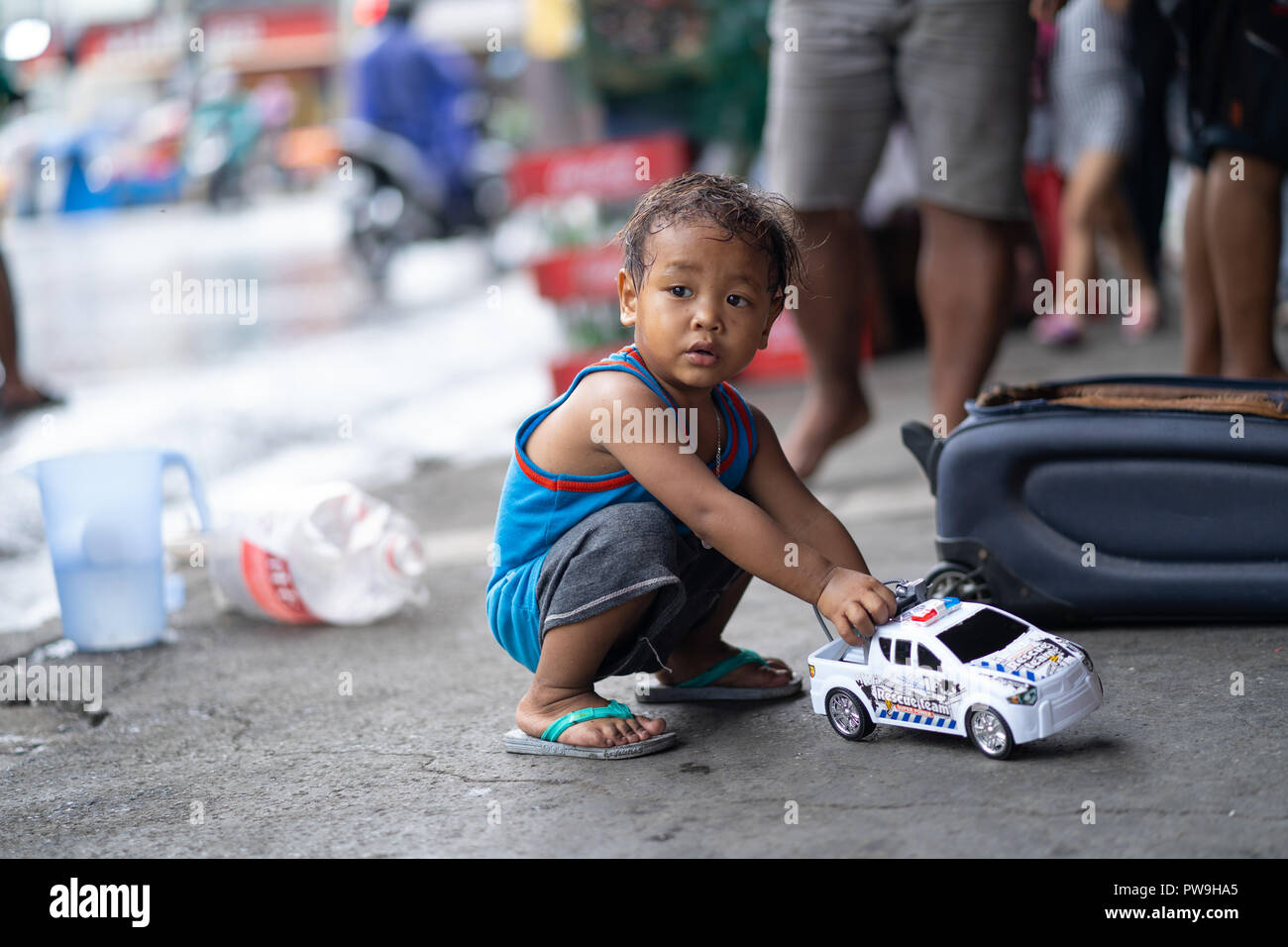 Children poverty playing toys hi-res stock photography and images - Alamy