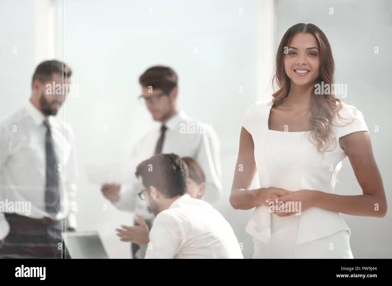 young employee standing in the office Stock Photo - Alamy