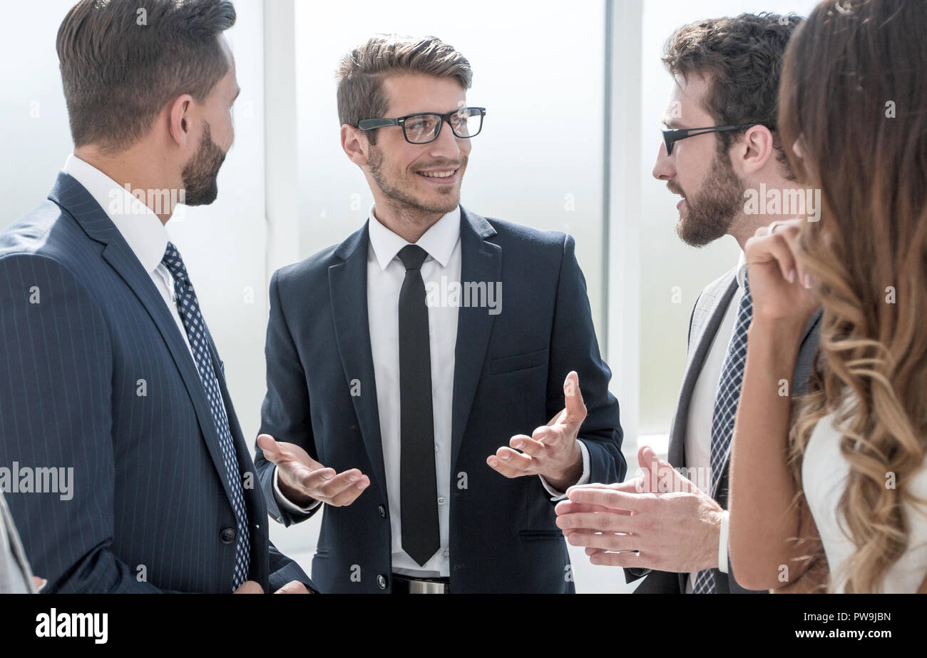 group of young entrepreneurs standing in the business center Stock ...