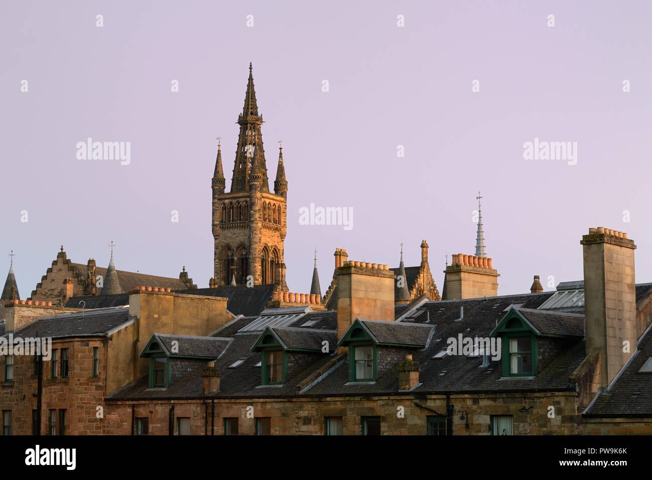 Glasgow University tower and old west end rooftops bathed in warm Autumn evening sunlight in Glasgow, Scotland, UK, Europe Stock Photo