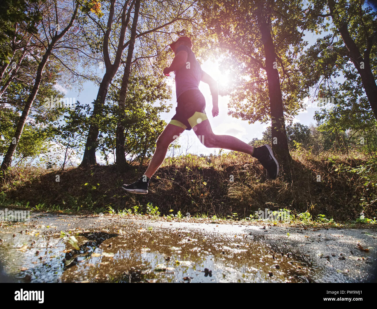 Recreation run during a sports activities in the open air forest. Summer running workout in health care and competition concept Stock Photo