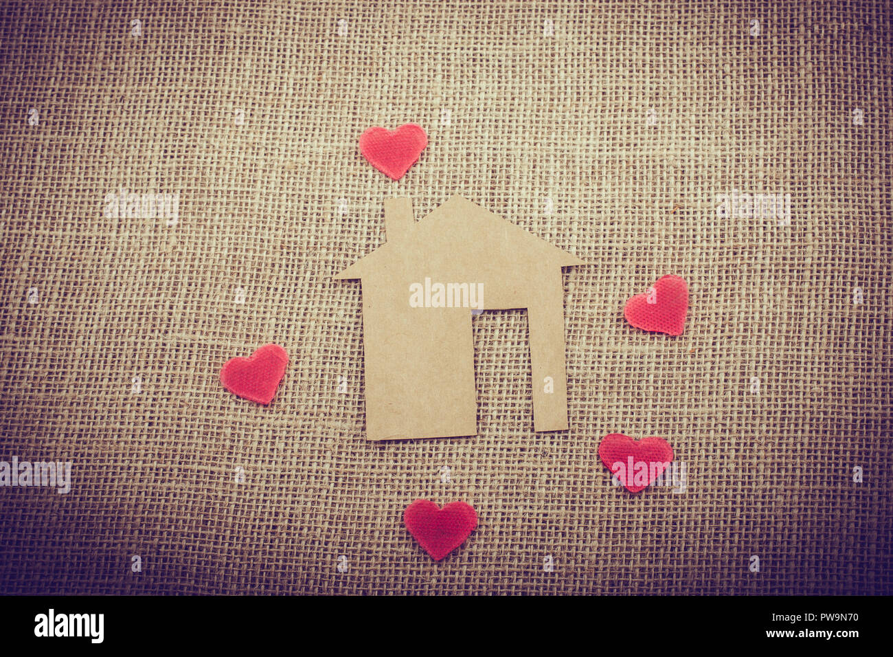 Heart shape around the paper house with a canvas background Stock Photo ...