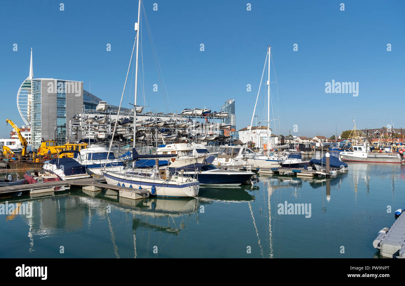 Liesure boats alongside The Camber area on Portsmouth Harbour, England, UK Spinnacker tower background. Stock Photo