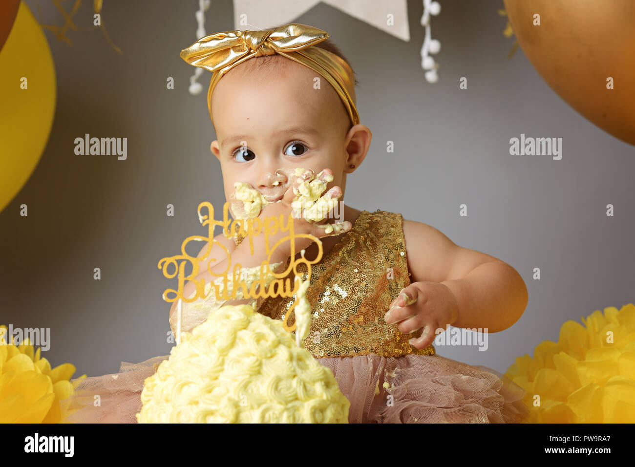 Cute little girl eating cake Stock Photo