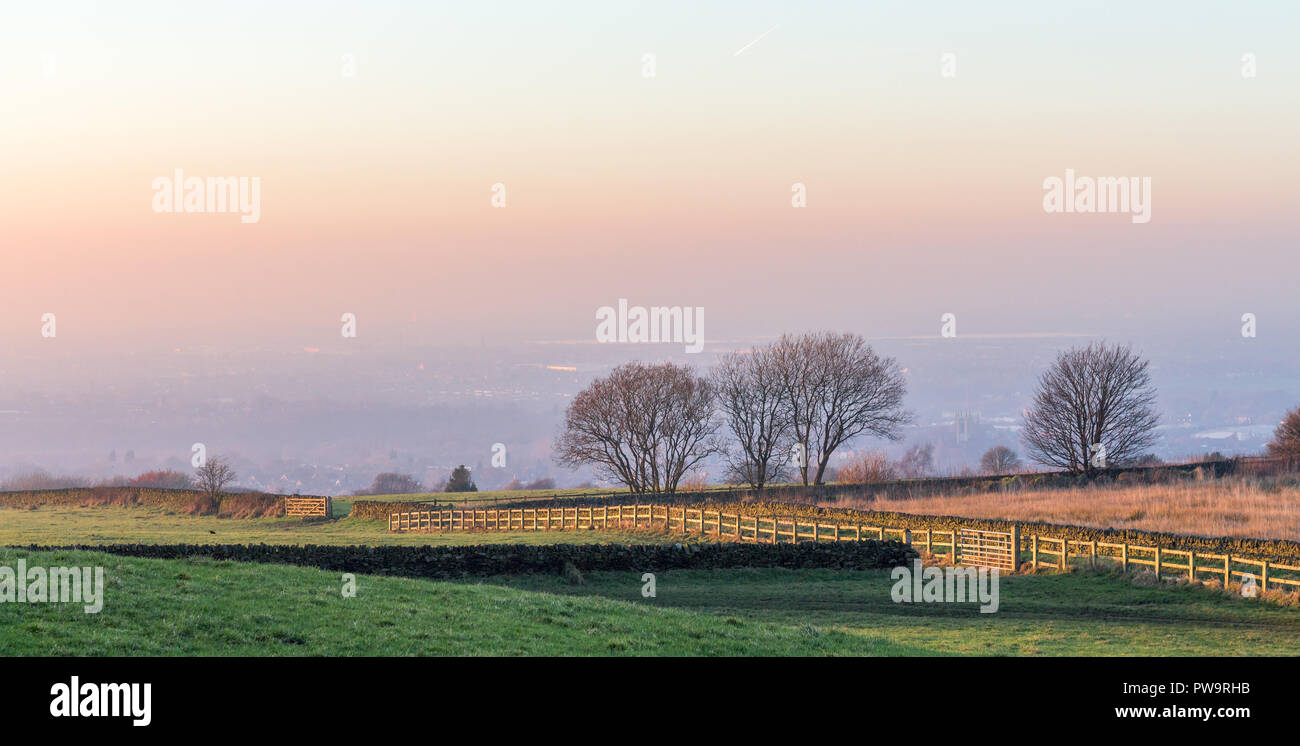 View of Manchester from Werneth Low, with hazy winter sky Stock Photo