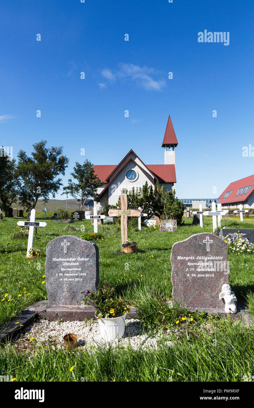 View of the cemetery and modern Church of Reykholt, Reykholtkirkja, Iceland Stock Photo