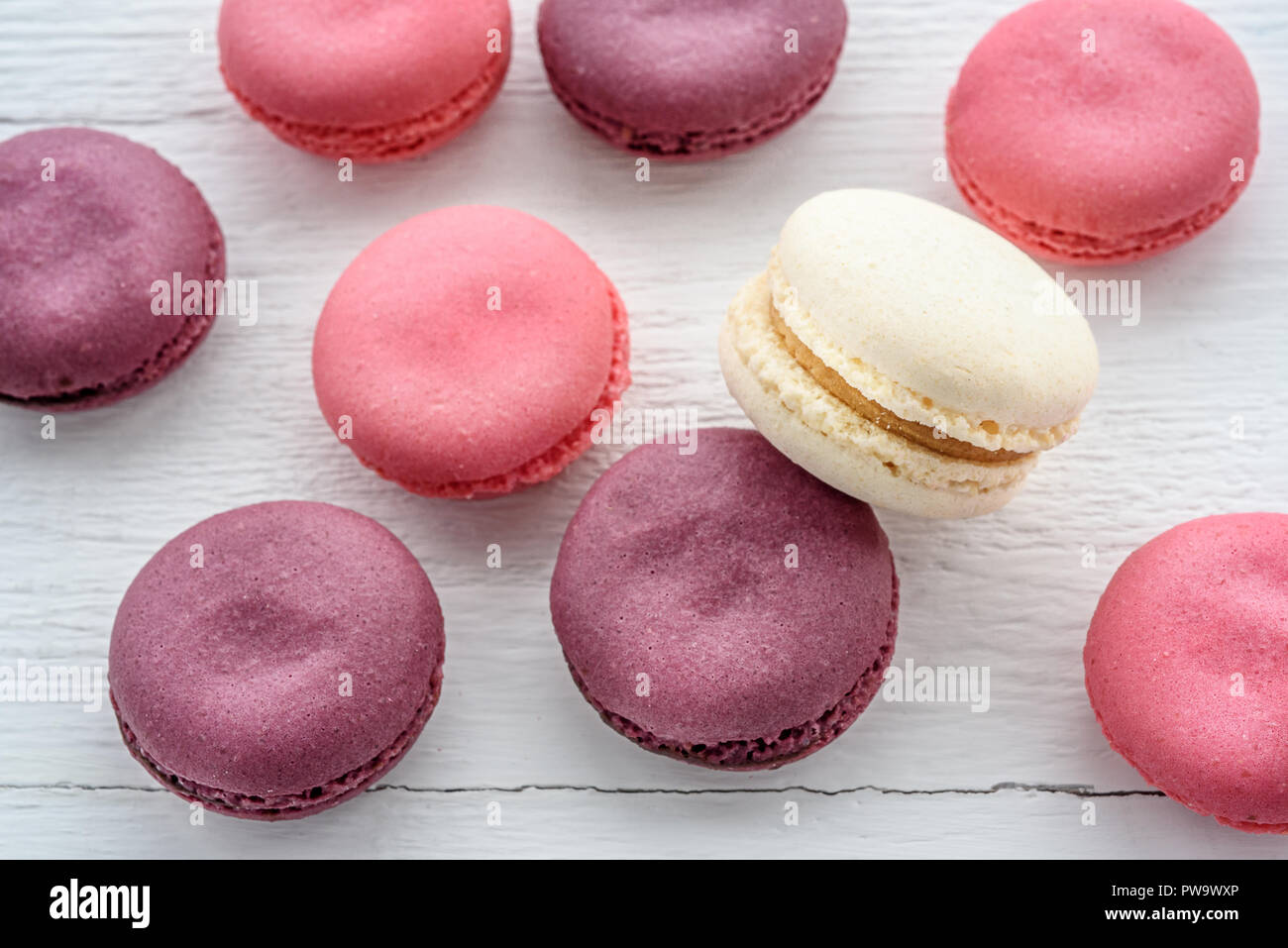 Sweet macarons on a white  background. Trendy cakes. Stock Photo