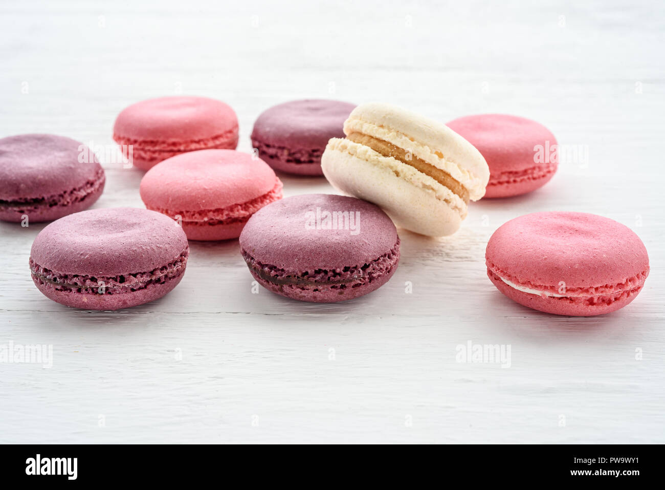 Sweet macarons on a white  background. Trendy cakes. Stock Photo