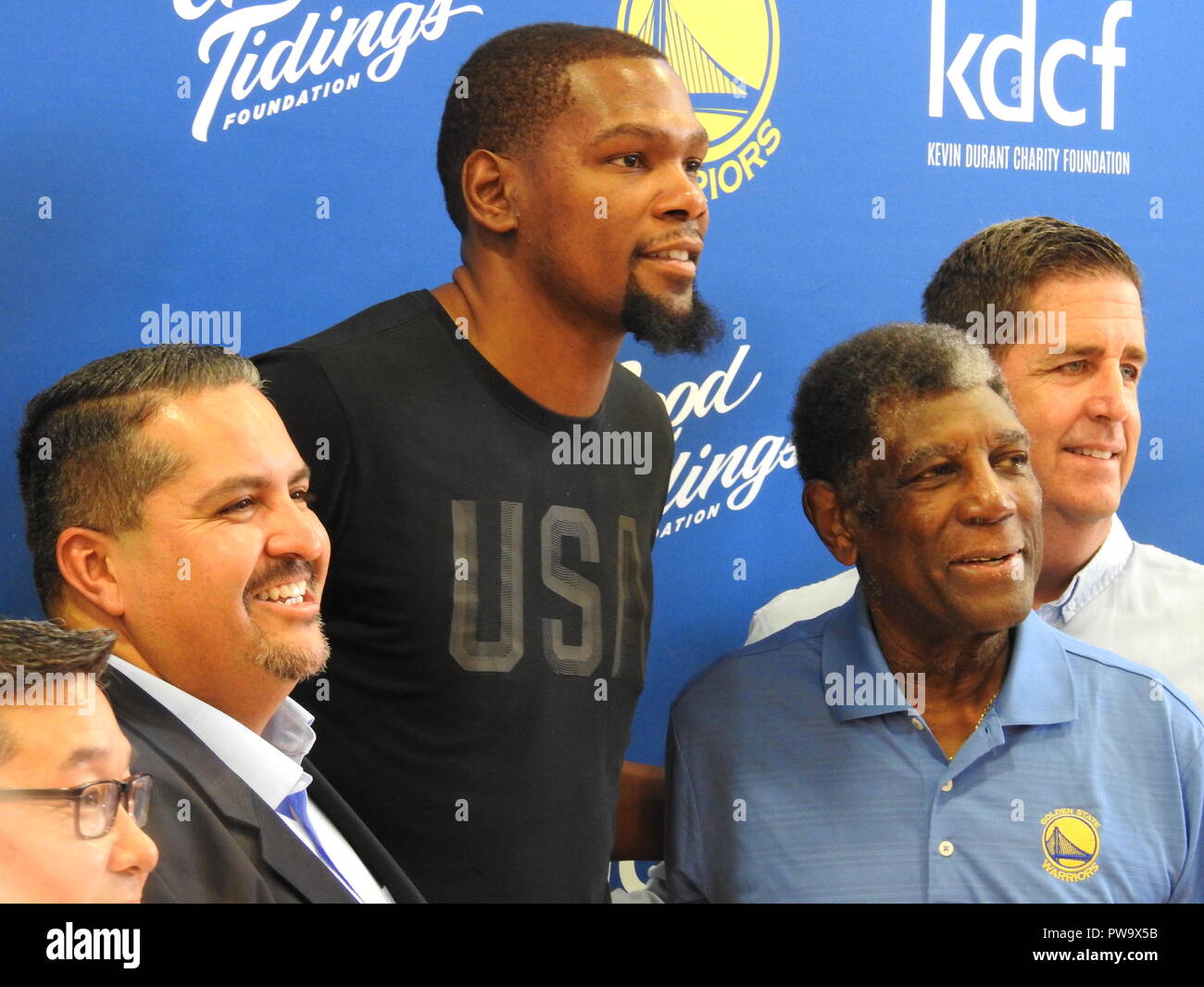 Oakland city councilmember Abel Guille, Golden State Warriors Finals MVP Kevin Durant, Warriors coach Al Attles and Good Tidings Foundation founder Larry Harper appear at an event to unveil four new basketball courts donated to the Lincoln Square Recreation Center in Oakland's Chinatown by the Kevin Durant Charity Foundation on May 17, 2017. Stock Photo