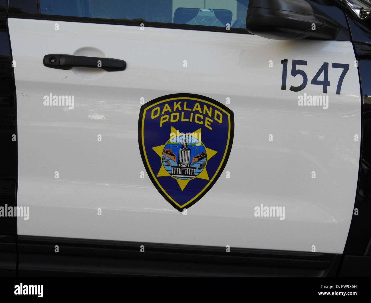 The door of an Oakland Police Department patrol car photographed at Frank Ogawa Plaza on June 28, 2017. Stock Photo