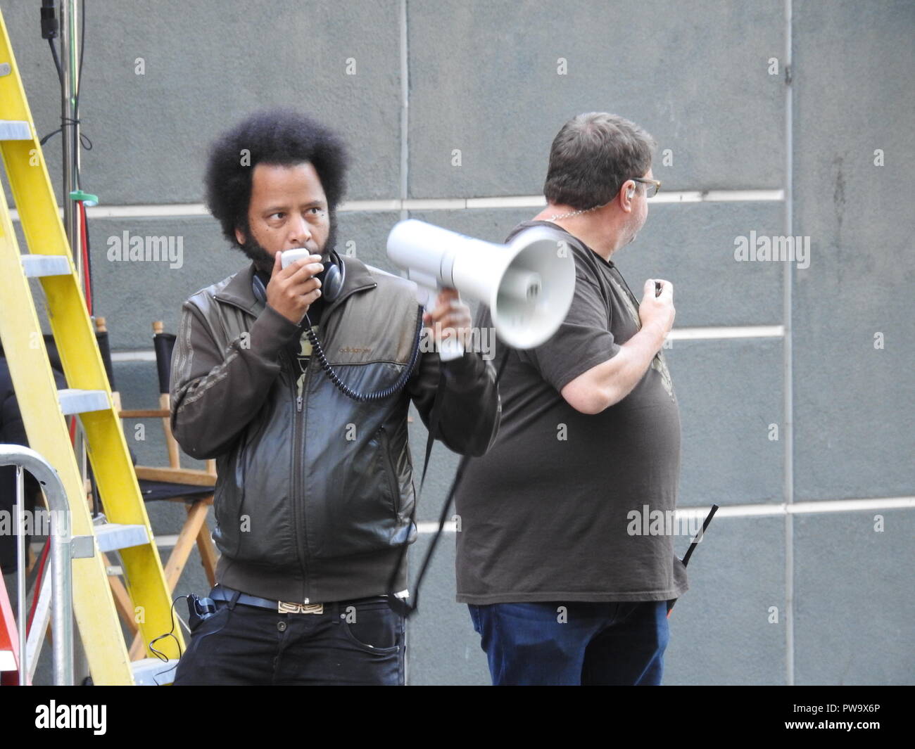 Rapper Boots Riley of the Coup on set on July 14, 2017, in downtown Oakland while directing his first movie, Sorry to Bother You. The film is a science fiction comedy set in Oakland and follows telemarketer Cassius Green, played by Lakieth Stanfield, who discovers a dark secret while climbing the corporate ladder. Stock Photo