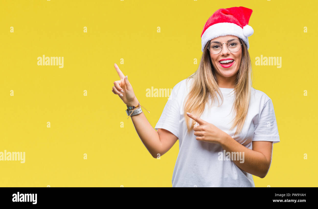 Young Beautiful Woman Wearing Christmas Hat Over Isolated Background 