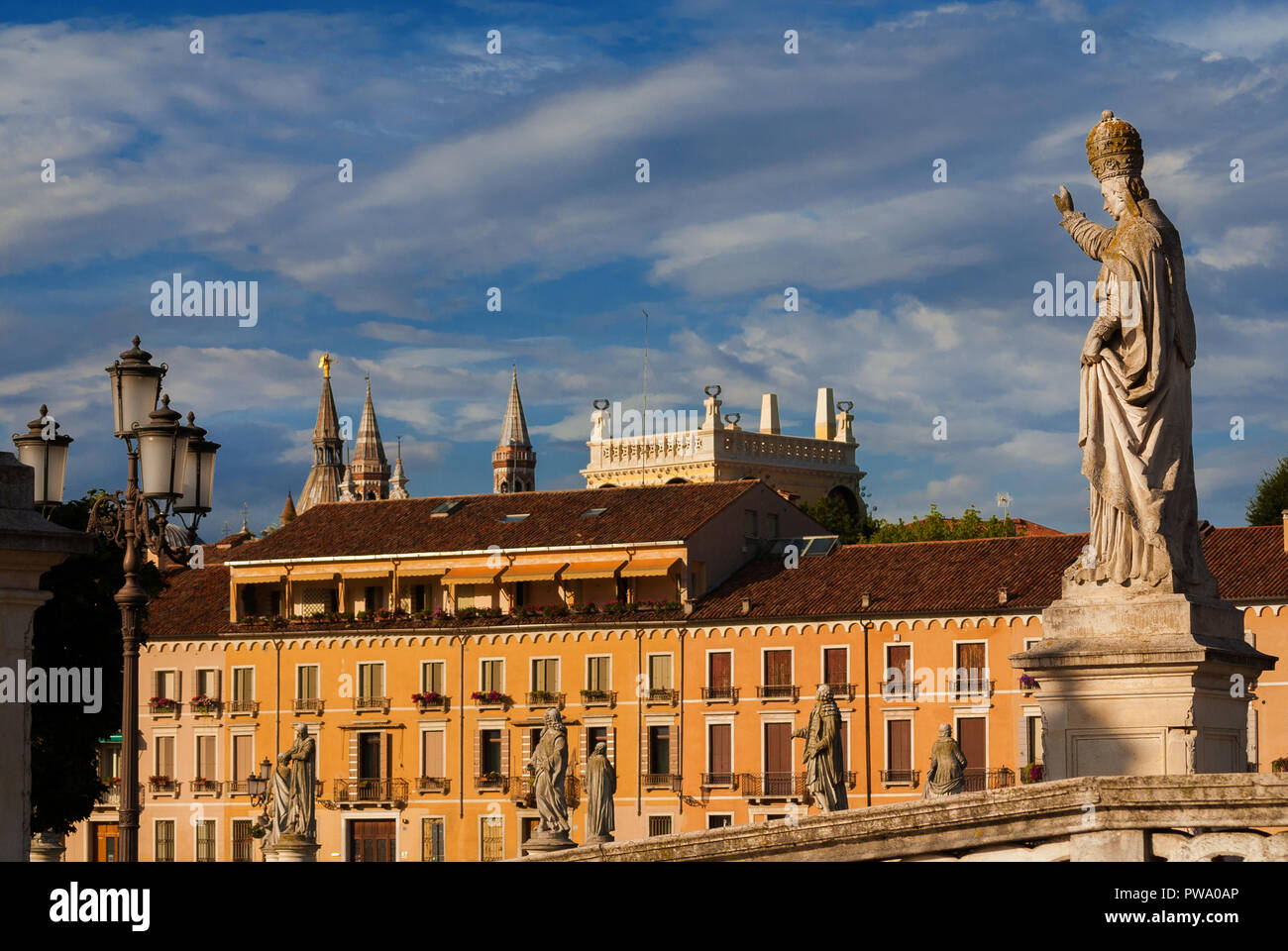 Pope Clement XIII statue bless the ancient city of Padua, from Prato della Valle (Lawn of the Valley) Square Park in the historic center Stock Photo