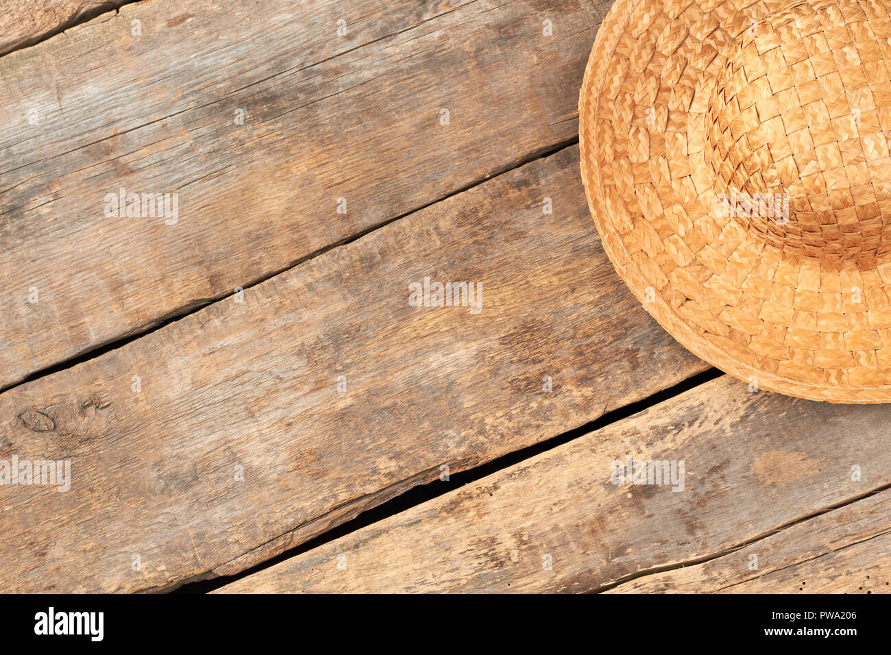 wooden background. Wicker hat 
