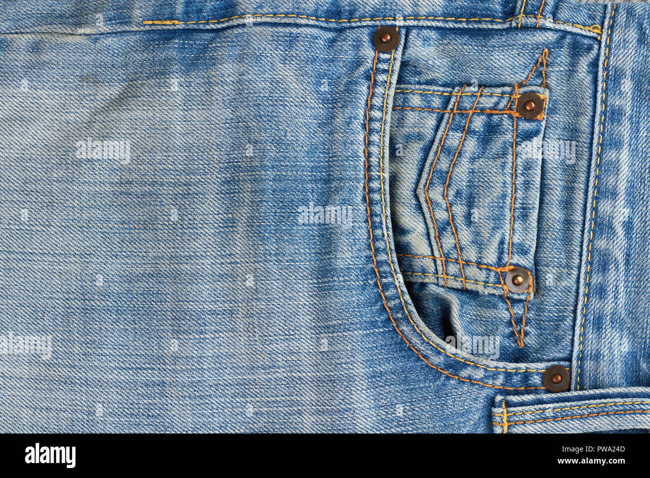Close up of denim jeans texture with seams. Pocket of brand jeans. Part of blue classic jeans close up. Stock Photo