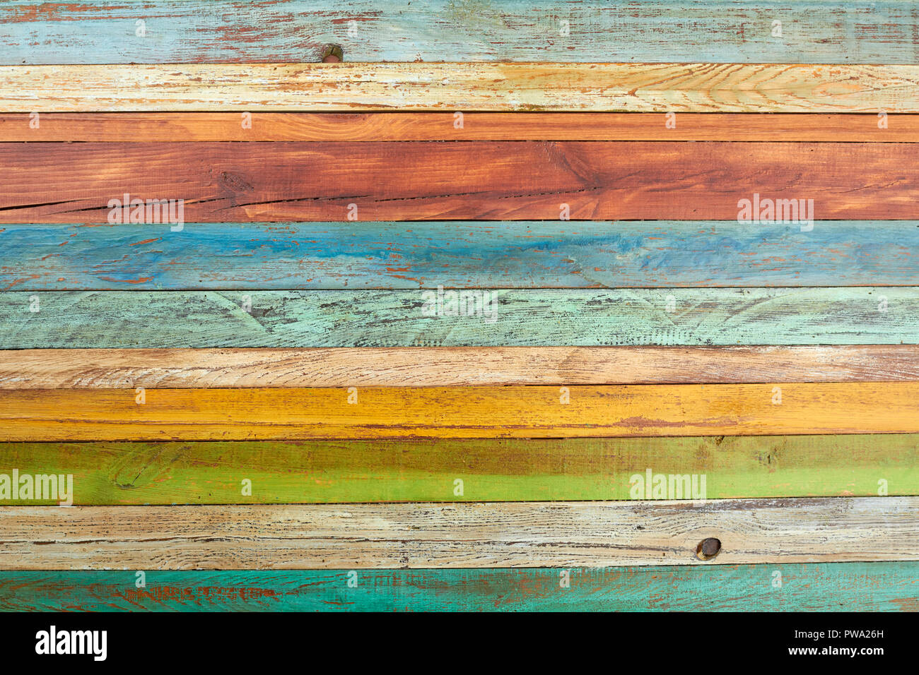 Old multicolored wooden background. Colorful wooden planks texture backdrop. Creative colorful wallpaper. Stock Photo