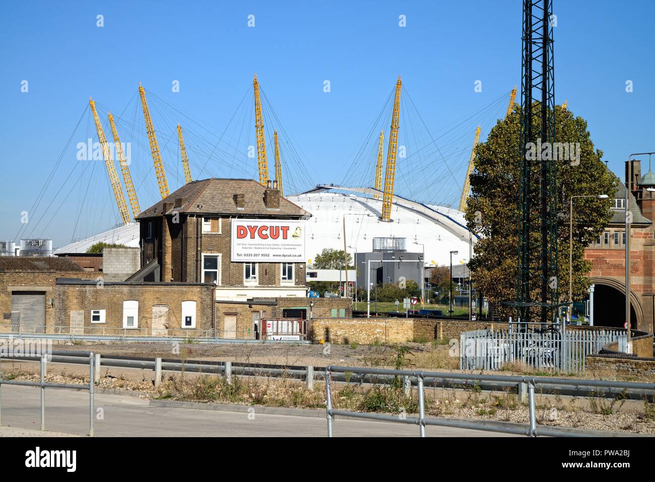 The O2 Dome amongst old industrial landscape at North Greenwich London England UK Stock Photo