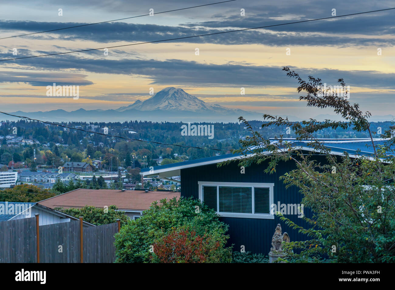A view of Mount Rainier at sunset from Des Moines, Washington. Stock Photo