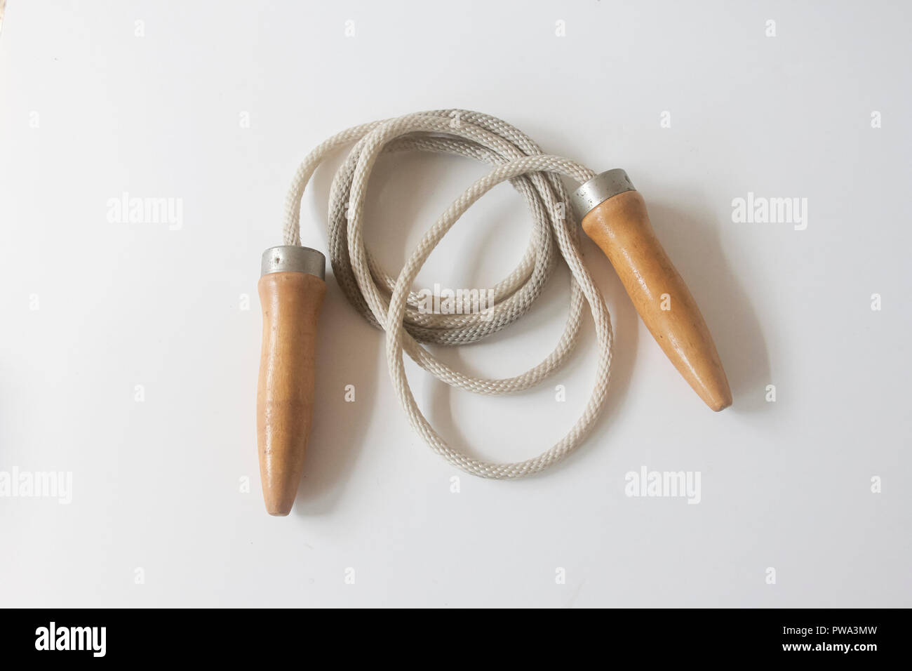 Vintage jump rope with wooden handles Stock Photo Alamy