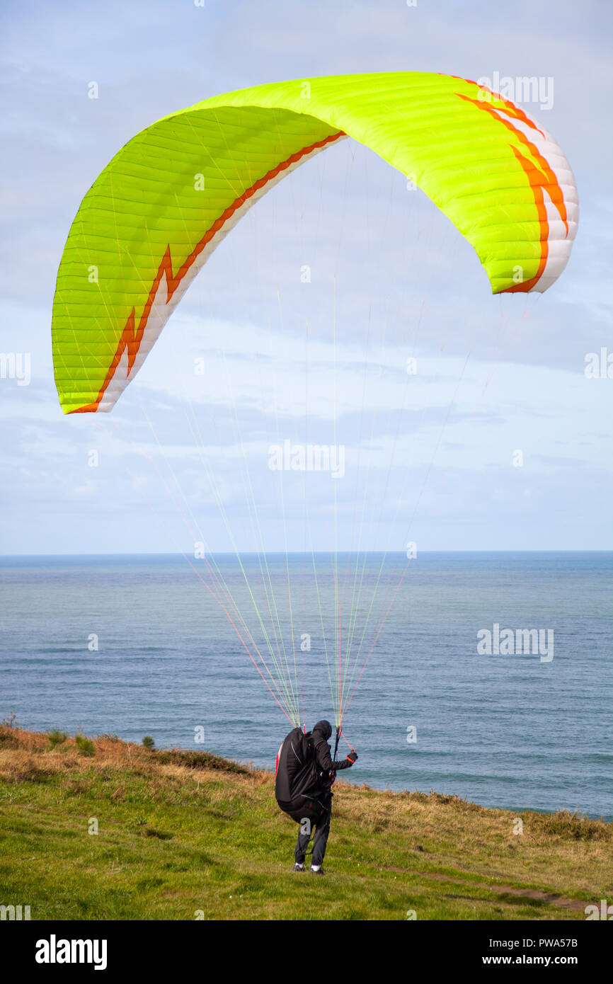 paragliding blast-off at the edge of the cliff Stock Photo