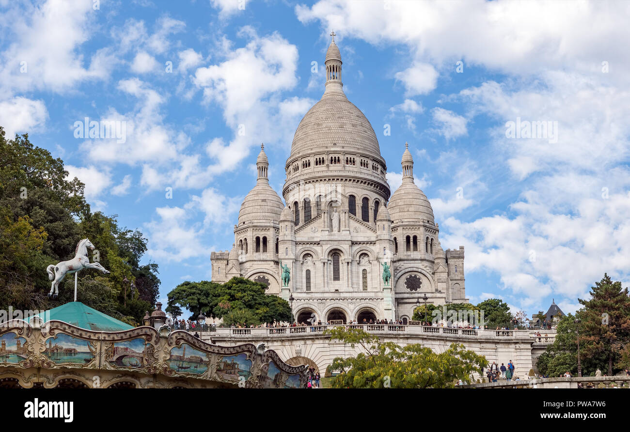 Sacre Coeur Basilica and Carrousel on Montmartre hill - Paris, France Stock Photo