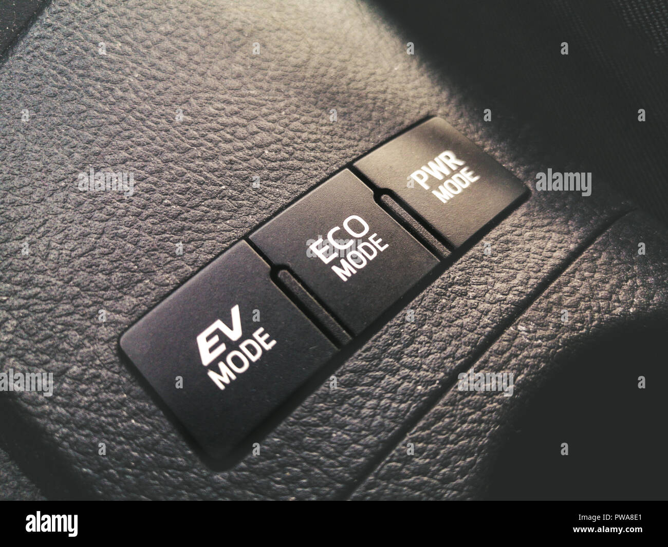 hybrid vehicle power technology - Eco mode Ev mode and Power driving mode buttons Stock Photo