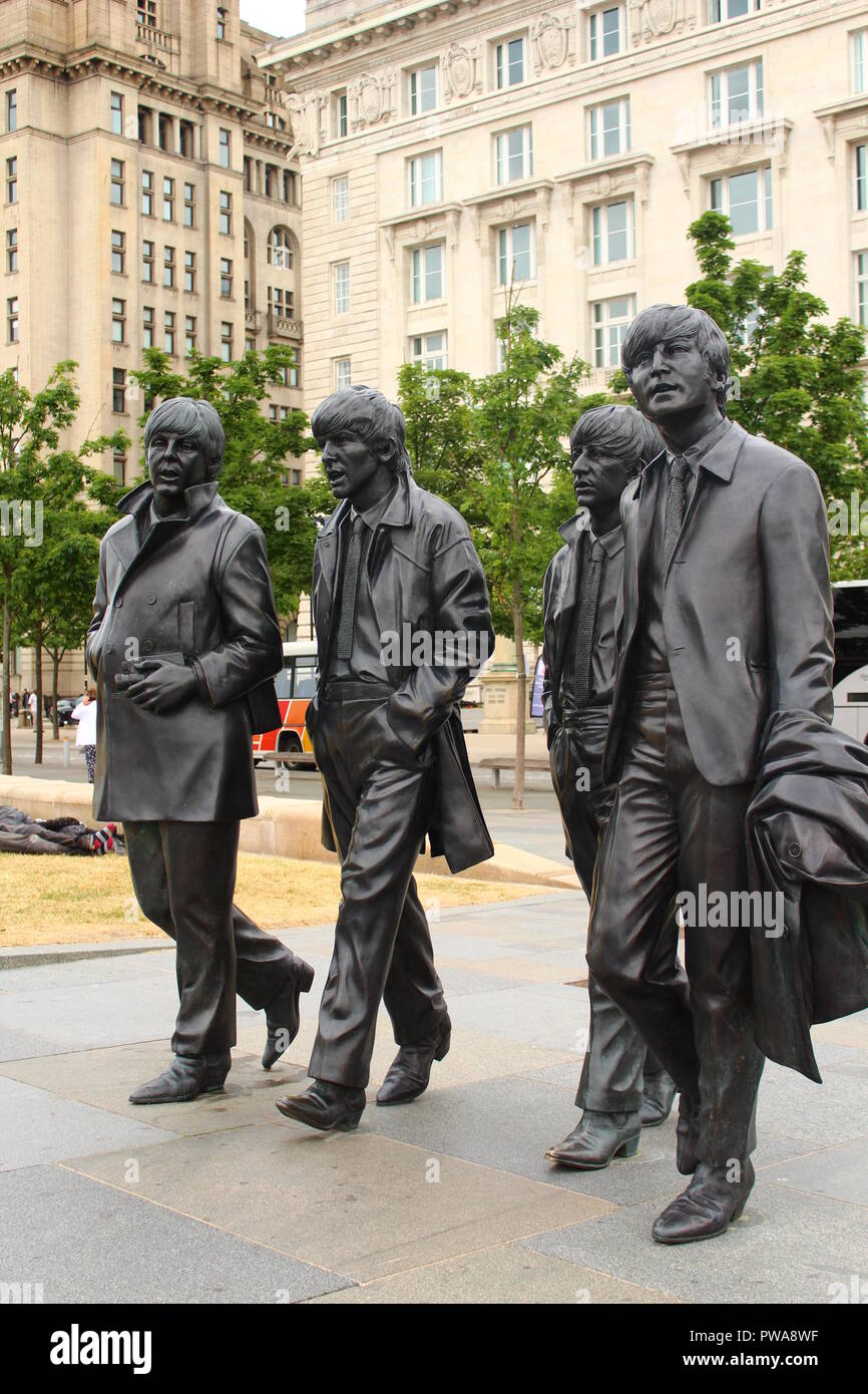 The Beatles Statue of John Lennon, Paul McCartney, George Harrison and Ringo Star in Liverpool Albert Dock Stock Photo